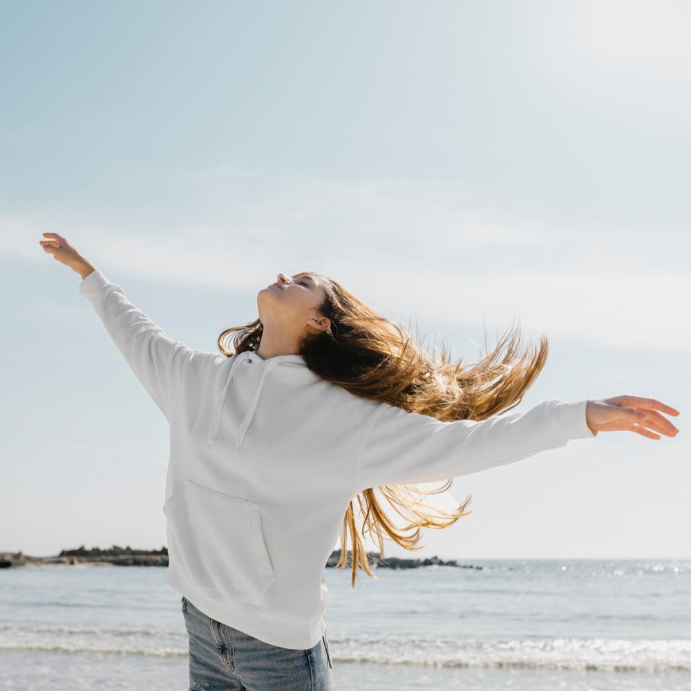 carefree woman near water