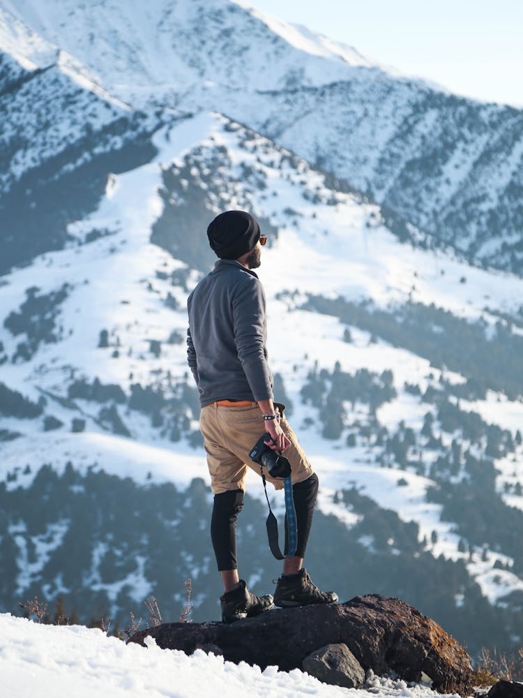 photographer hiking in alberta mountains